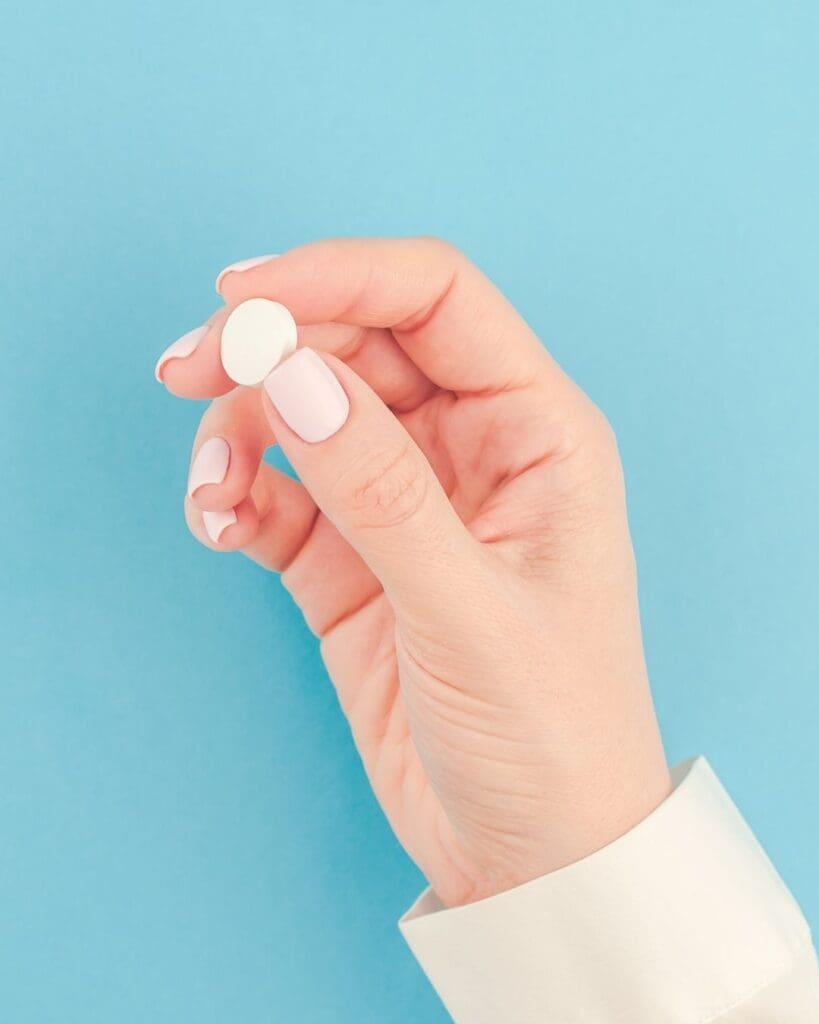 Woman holding bill on a blue background