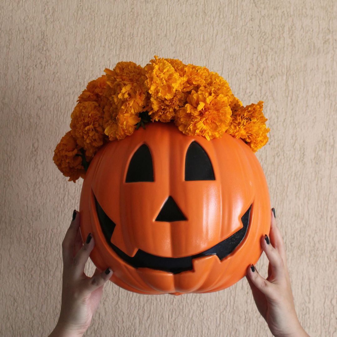 Pumpkin with flowers inside of it
